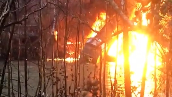 CSX workers cling to burning train derailed into Kentucky river
