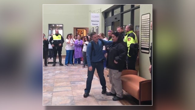 Texas police department gathers to celebrate officer's final chemo treatment