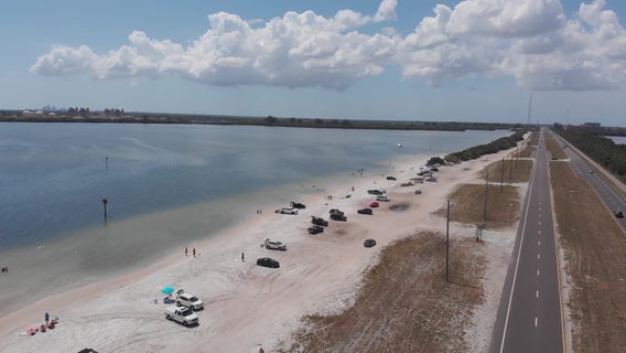 Barricades, city order didn't stop dozens from soaking up sun at closed Gandy Beach