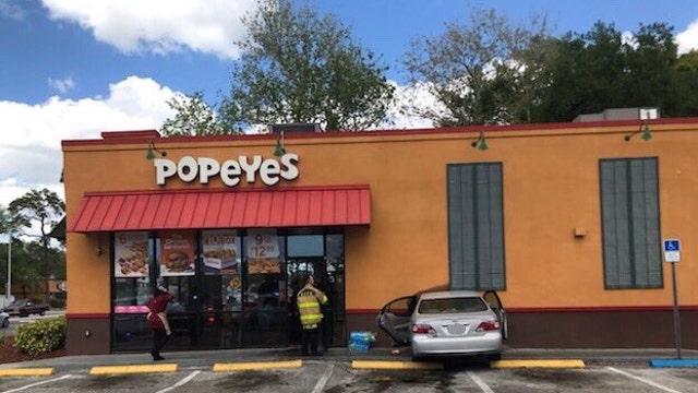 Police: Woman mistakes gas for brake, drives into Sarasota Popeyes