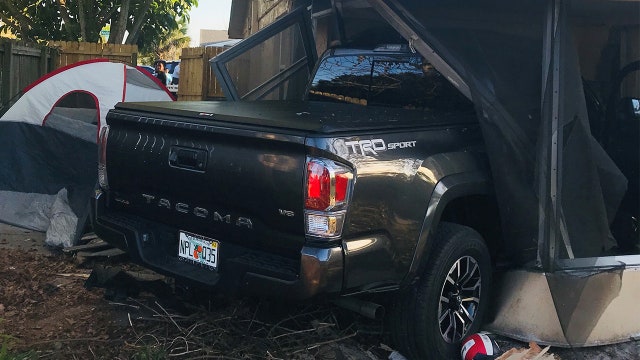 Pickup truck crashes into Port Richey home