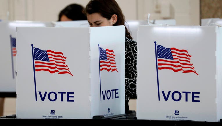 People vote in the Michigan primary election at Chrysler Elementary School in Detroit, Michigan, on March 10, 2020. 