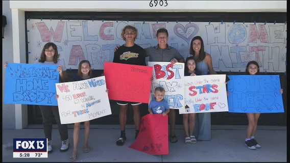 Father of 7 reunites with family after 14 months deployed, 14 days in quarantine