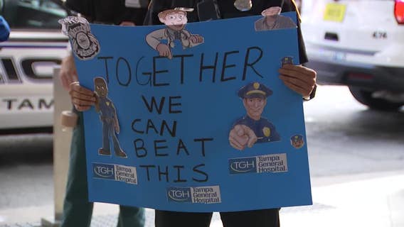 Tampa police officers line up to thank Tampa General Hospital workers