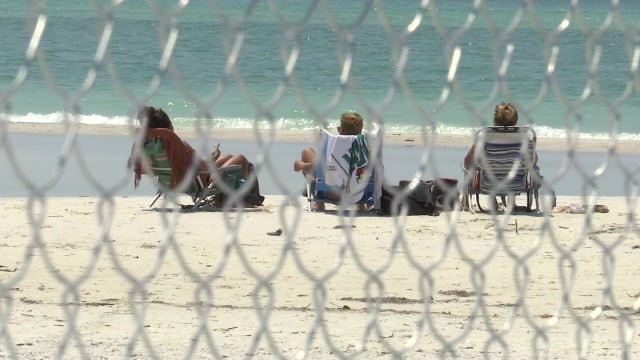 Siesta Key resident builds fence to keep people off private beaches not closed under county order