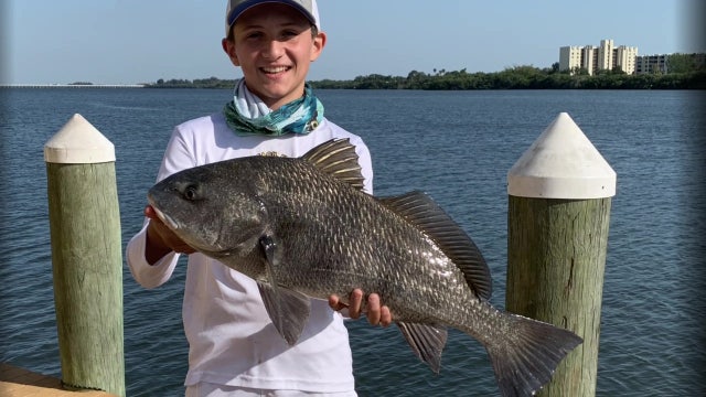Gone Fishing; Teenage angler finds comfort on the water while social distancing