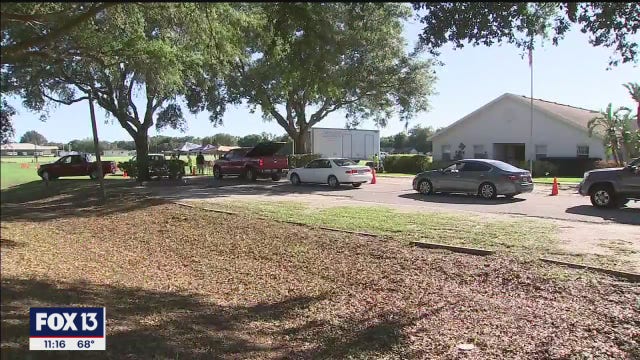 Drive-through food pantry helps Parrish residents get by