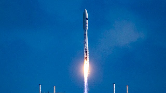 Robotic space plane returns to orbit after hazy Florida launch