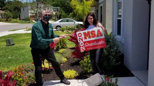 Teachers surprise 250 graduating seniors by hand-delivering caps, gowns 