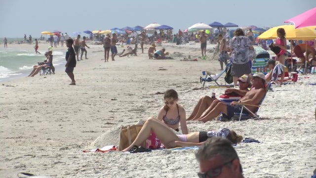 Social distancing, law enforcement in place as people head back to the beach