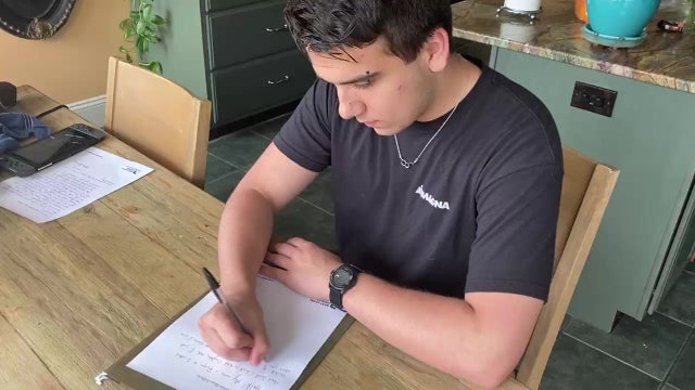 Church volunteers write letters of hope for those struggling during the coronavirus pandemic