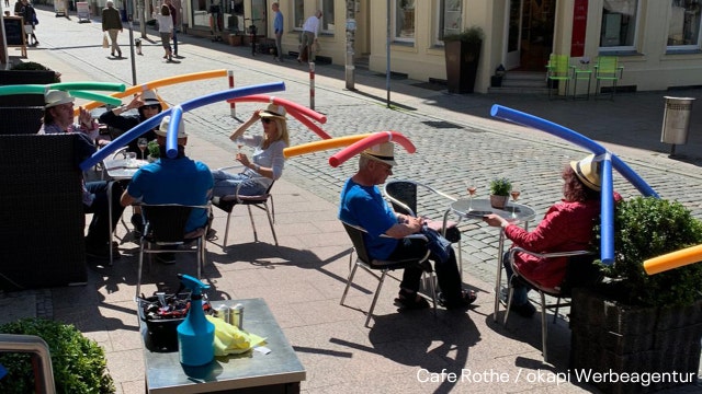 German cafe gives swimming pool noodle hats to diners to ensure social distancing