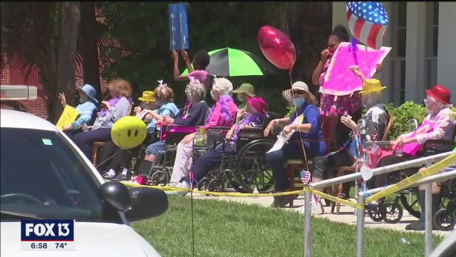 Parade brightens spirits of Manatee River assisted Living residents, family members