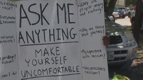 Dripping Springs man carries sign welcoming conversations about race