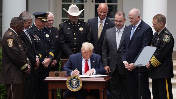 Trump signs order on police reform, doesn't mention racism