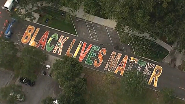 Volunteers paint 'Black Lives Matter' mural on St. Pete street