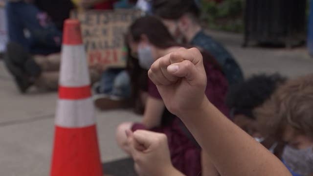 Protesters continue to share their message peacefully at Curtis Hixon Park in Tampa