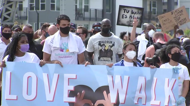 Titus O’Neil, Dave Bautista lead 'Love Walk' through Tampa to inspire change