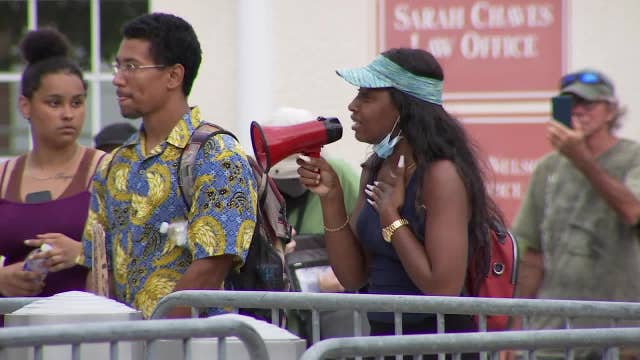 Protesters brave downpours, remain peaceful in St. Petersburg Monday