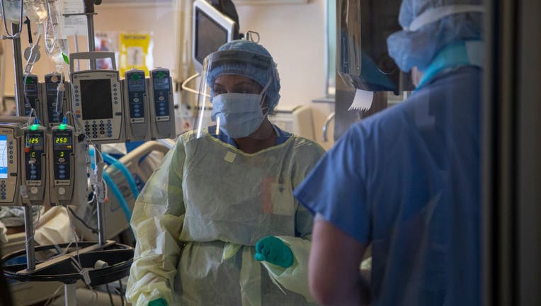 A nurse checks intravenous drug dosages being given to a COVID-19 patient on the Intensive Care Unit (ICU) floor at the Veterans Affairs Medical Center on April 21, 2020 in the Brooklyn borough of New York City.