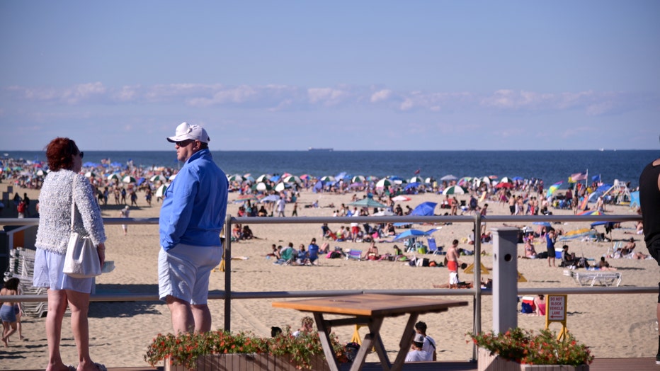 eca11988-Crowds Flock To Jersey Shore For Summer Weather On The Weekend