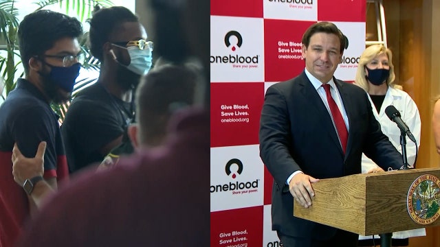 Protesters yell at Gov. Ron DeSantis as he urges Floridians to donate plasma