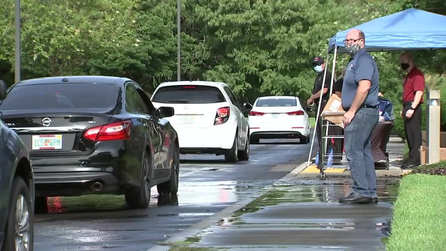 Hundreds stock up on essential storm supplies at the Largo Fire Rescue's drive-thru hurricane expo