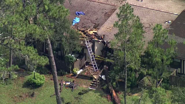 Fallen tree traps two inside Pasco County home