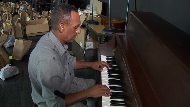 Hitting a high note; Tampa middle school custodian makes music for teachers, students