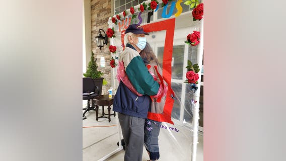 Hugging station reunites loved ones at Alpharetta assisted living facility