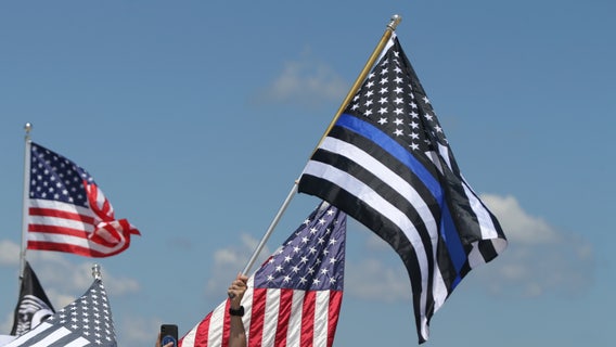 Florida high school bans football team's police flag after critics deem it "openly racist"