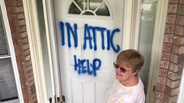 Elderly Florida couple trapped in attic rescued from flood by firefighter on a jet ski