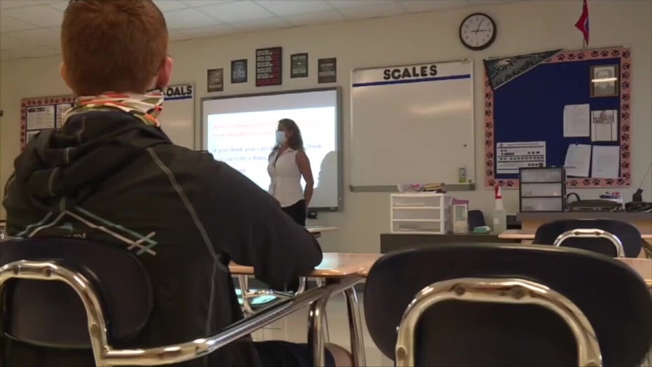 Teacher and student in classroom