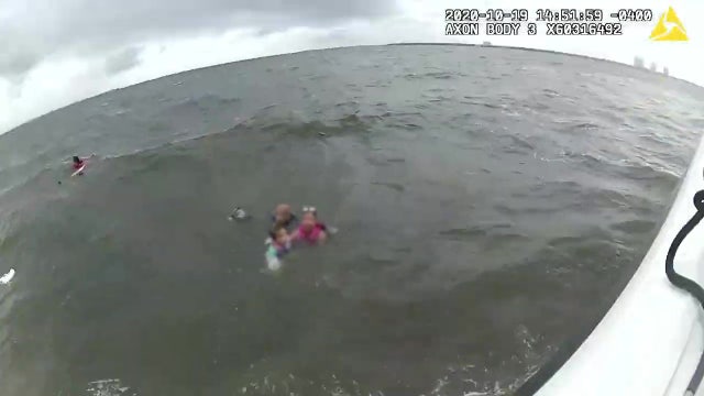 7 rescued from bay after boat capsizes during stormy weather