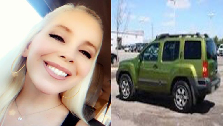 Tracey Reiker next to Nissan