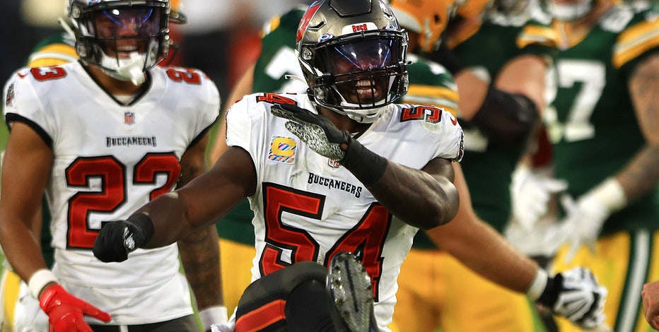Dominating defense helps Brady, Buccaneers top Packers