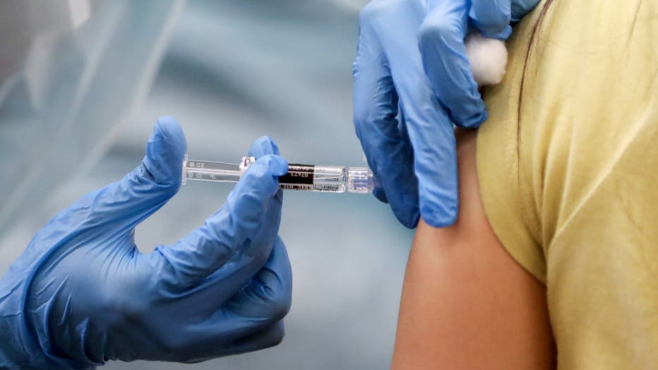 Southern California Residents Line Up For Flu Shots At Local Library