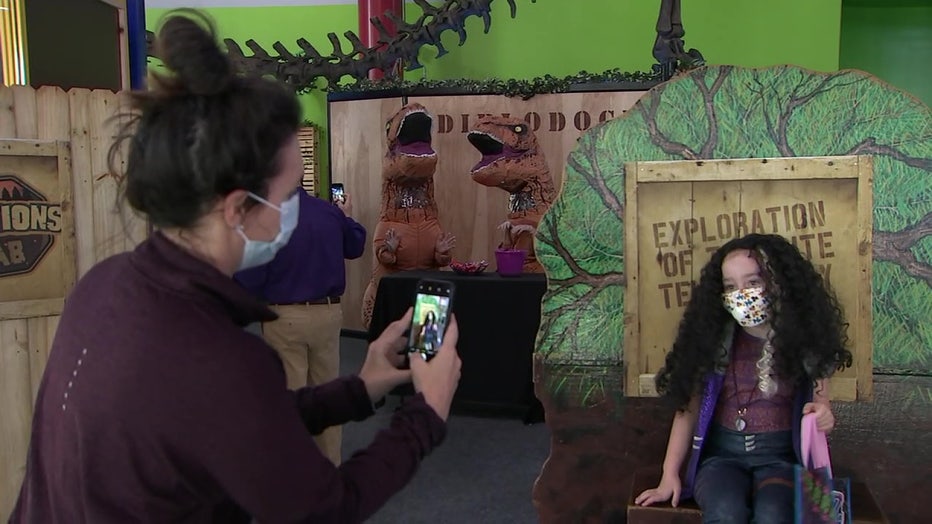 Woman taking photo of girl at MOSI