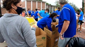 Jesuit High School students provide Thanksgiving meals for more than 200 families