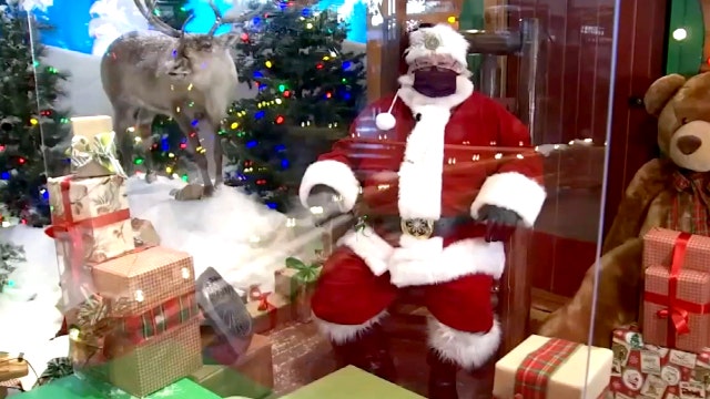 Here comes Santa Claus - with plexiglass and face masks