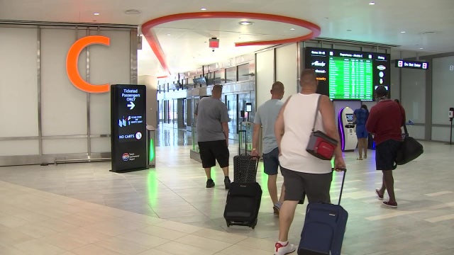 Despite warnings, millions stick to Thanksgiving travel plans