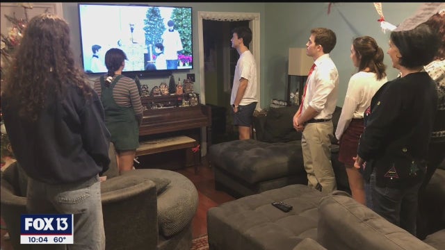 Families gather around streaming church services Christmas Eve