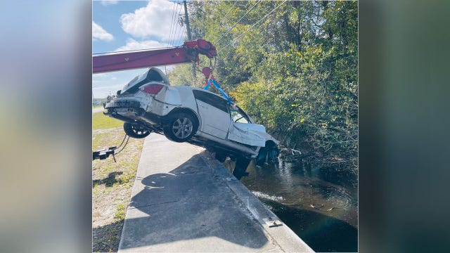 FHP: Woman dies after vehicle plunges 20 feet into pond following crash