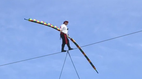 Daredevil Nik Wallenda, dressed as a pirate, walks wire across Legoland
