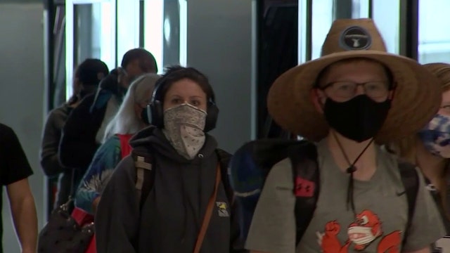 When could restrictions ease after COVID-19 vaccines become available to all adults?