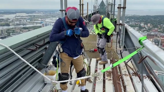 Replacing the iconic metal roof of Tampa's tallest building is not for the faint of heart