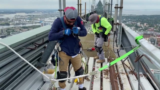 Replacing the iconic metal roof of Tampa's tallest building is not for the faint of heart