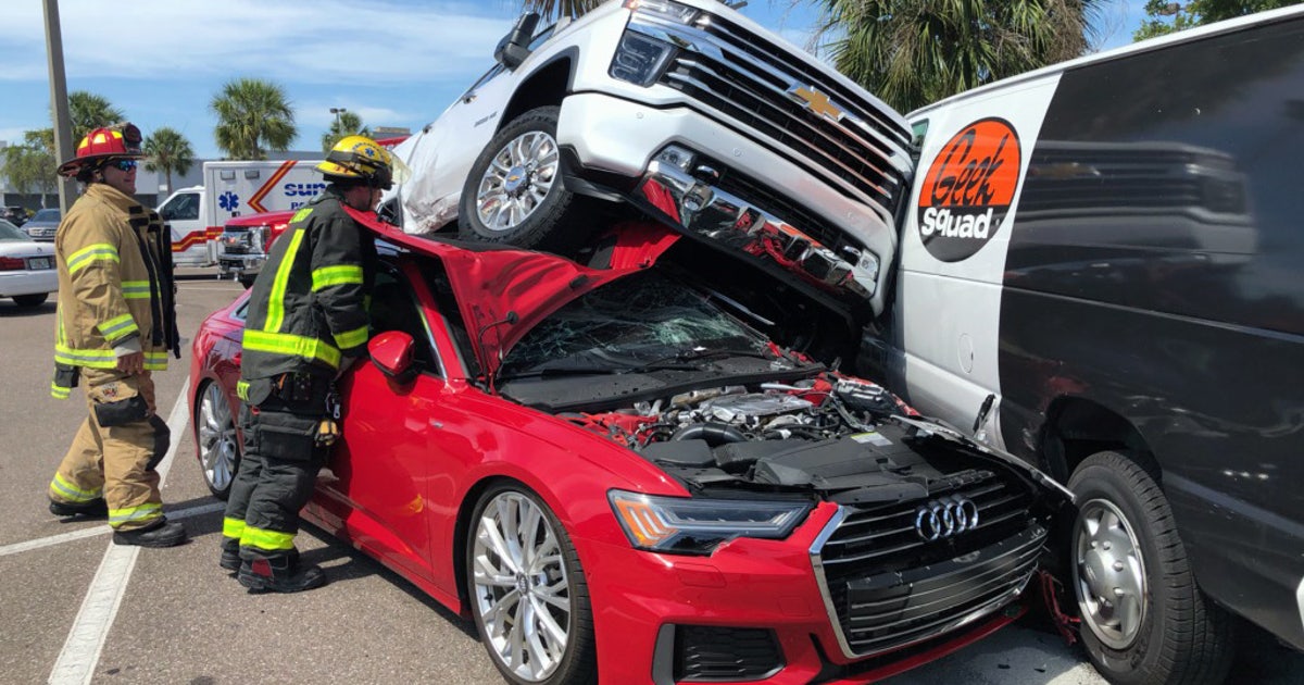 Clearwater parking lot crash leaves truck atop sedan | FOX 13 Tampa Bay