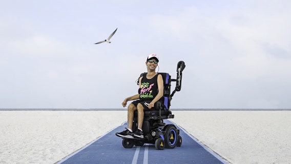 With a contagious smile, St. Pete man with Cerebral palsy becomes model for Florida beachwear company