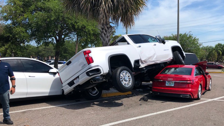 Clearwater parking lot crash leaves truck atop sedan